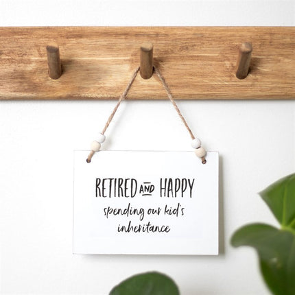 Retired and happy hanging sign